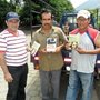 men holding Plough books