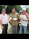 men holding Plough books
