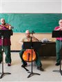 inmates playing stringed instruments
