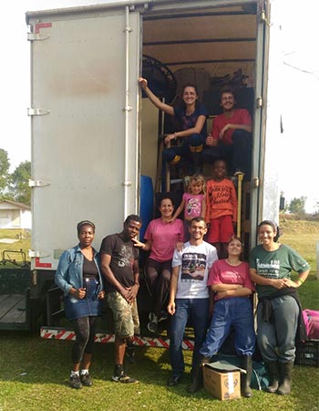 members of Casa de Videira in front of a truck