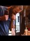 man using a chisel in a wood shop