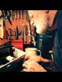 The repair man and his tools: Arnold Mommsen, a Bruderhof member, salvages a typewriter.
