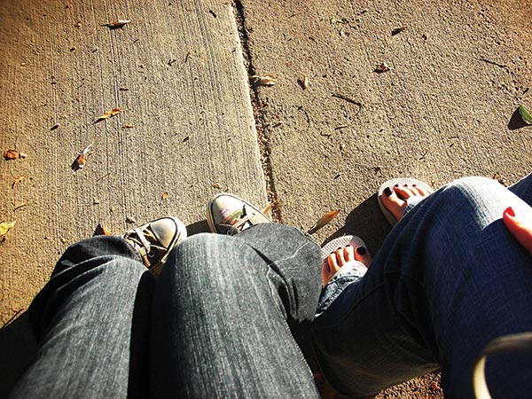 friends sitting side by side
