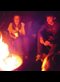 teenagers around a campfire in the dark