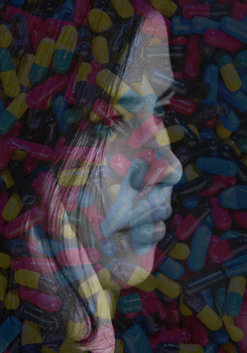 transparent image of a woman over photograph of pills