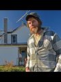 a man standing in front of an old house