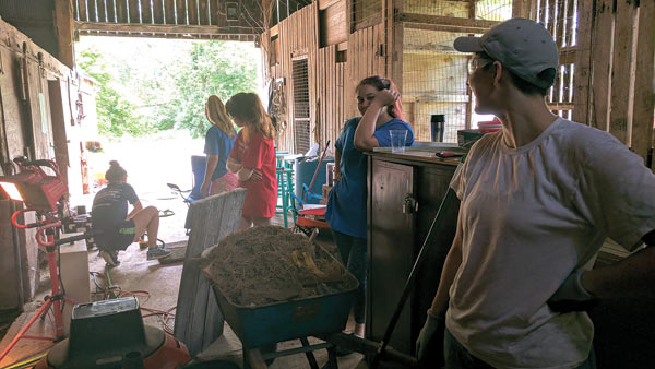 Empower Youth interns and volunteers renovate the Barn Studio, 2017.