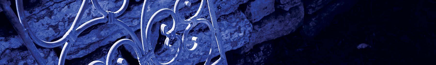 sunlight on the ironwork of a patio chair