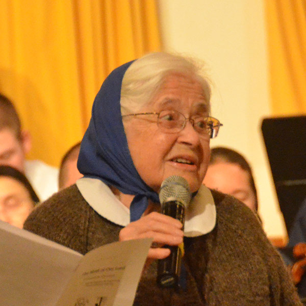 Marlys Swinger introducing one of her choral works