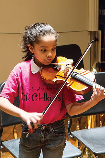 A violin student from the Baltimore Symphony Orchestra’s OrchKids program
