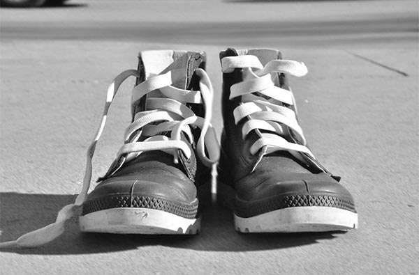 a black and white photograph of a pair of sneakers