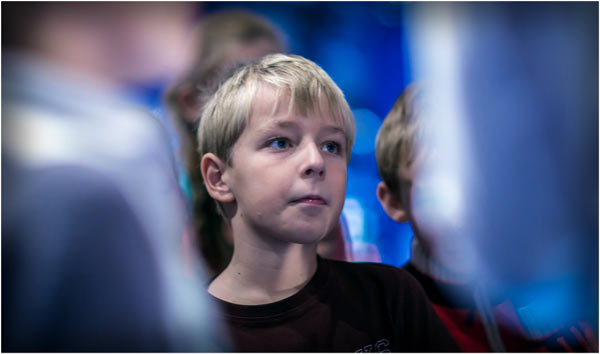 Photograph of a boy in school