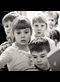 a line of children entering a door