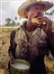 a man eating bread in a field surrounded by palm trees: André Chung, Cane Cutter, Havana, Cuba