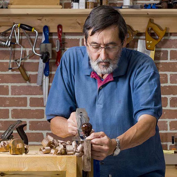 a carpenter working in his workshop