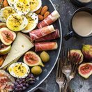 photo of plate of food and mugs of coffee