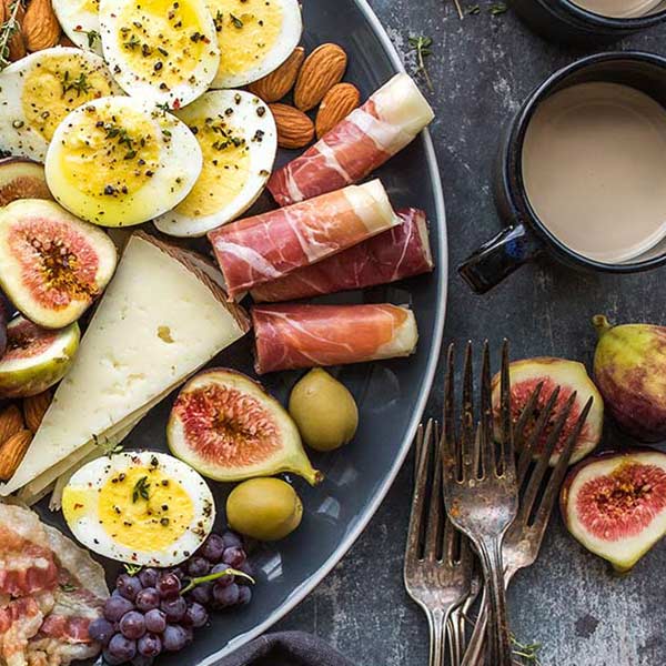 photo of plate of food and mugs of coffee