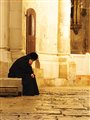 A pilgrim rests at the Church of the Holy Sepulchre, Jerusalem.