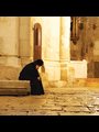 A pilgrim rests at the Church of the Holy Sepulchre, Jerusalem.