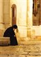 A pilgrim rests at the Church of the Holy Sepulchre, Jerusalem.