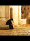 A pilgrim rests at the Church of the Holy Sepulchre, Jerusalem.