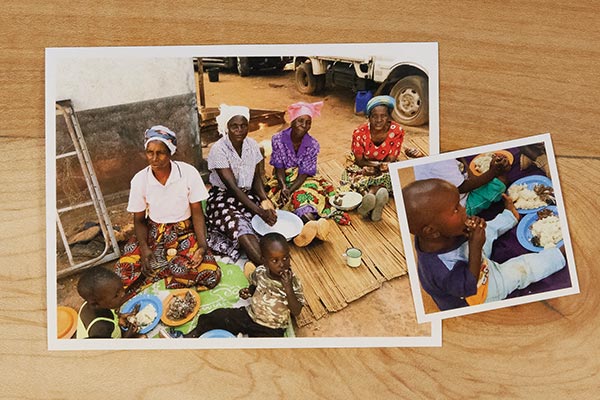 two photos on a wooden table of women and children in Nigeria eating together