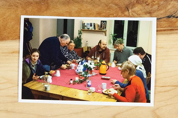 a photo on a wooden table people eating together