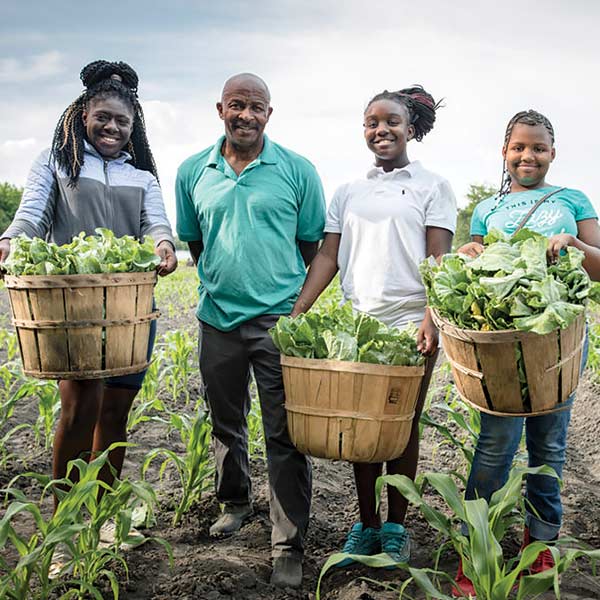 Richard Joyner at Conetoe Family Life Center with coworker