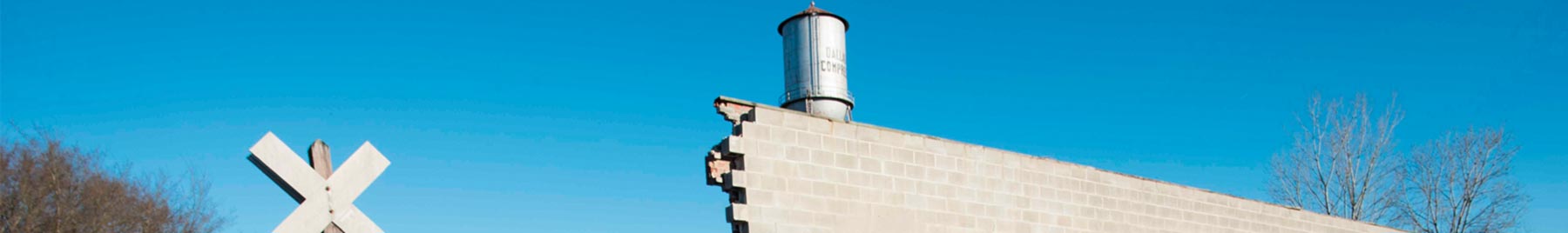 blue sky above a crumbling brick building