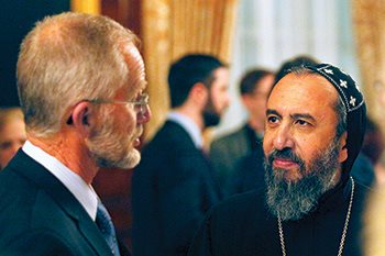 Archbishop Angaelos with Bruderhof elder Paul Winter at an event commemorating the twenty-one Coptic martyrs.
