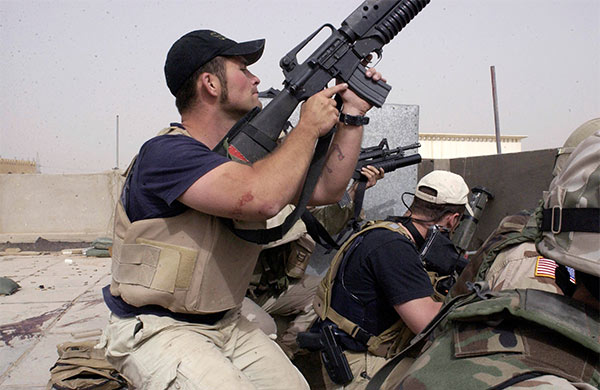 Blackwater USA contractors engage in a firefight with Iraqi insurgents, April 4, 2004.