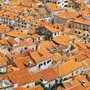 an overhead view of orange tiled roofs