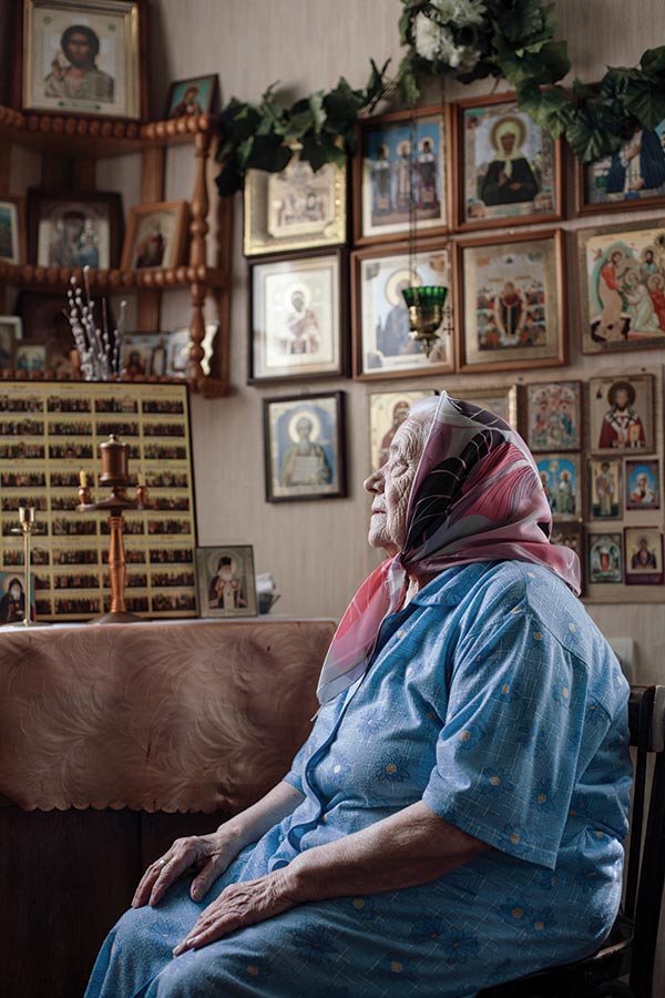 Ninety-five-year-old Varvara, the oldest parishioner of the Church of Saint Michael, at her home