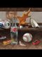 Detail from Painting of Curios: Beer can, dice, shell, harmonica, brown leaf