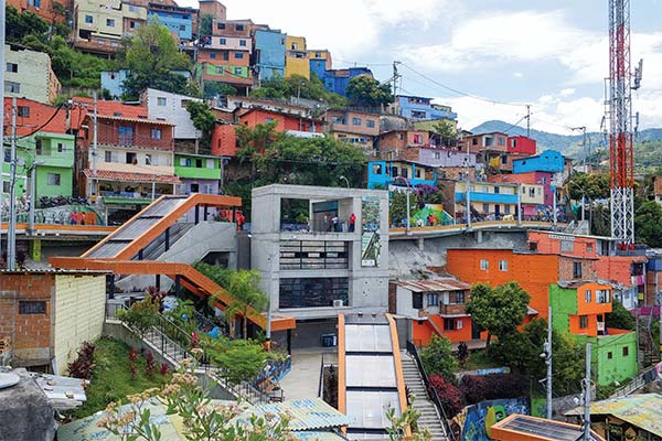 The steep hillside on which Comuna 13 sits is now accessible by a system of escalators.