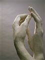 sculpture of two hands touching