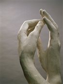 sculpture of two hands touching
