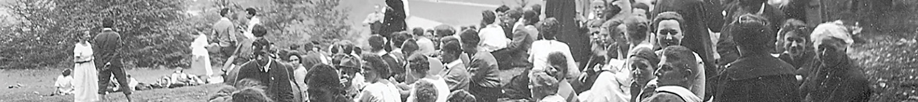 a crowd sitting on a hillside in Germany