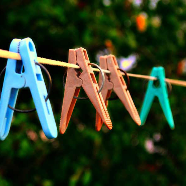 Colorful clothespins on a clothesline