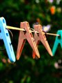 Colorful clothespins on a clothesline