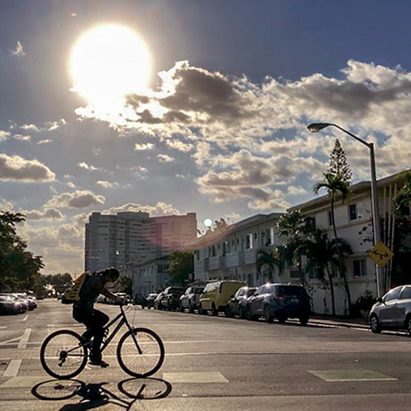 a man riding a bicycle on a deserted street
