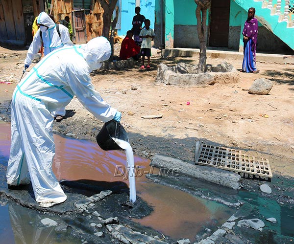 workers cleaning sewage in the streets