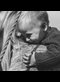black and white photograph of a little boy hugging his mother