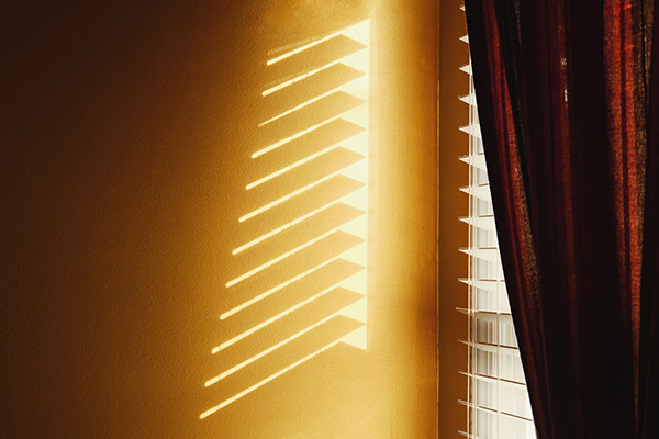 morning light shining through window blinds