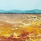 illustration of orange and yellow cracked earth with blue mountains in the distance