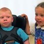 two kids smiling