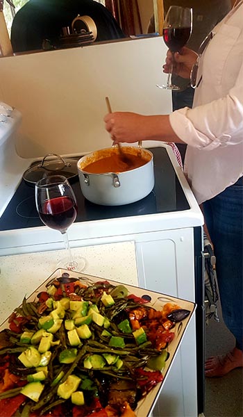 a woman cooking at a stove