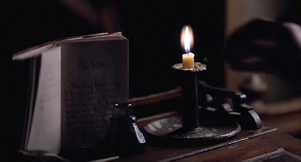 A candle on a desk