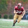 a football player running across a field