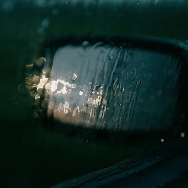 rain soaked rearview mirror
